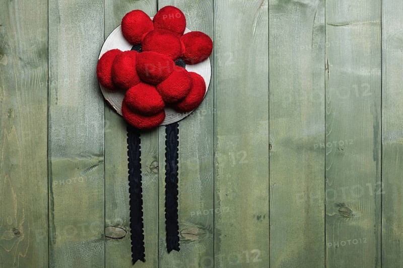Original Black Forest Bollen hat in front of green wooden wall