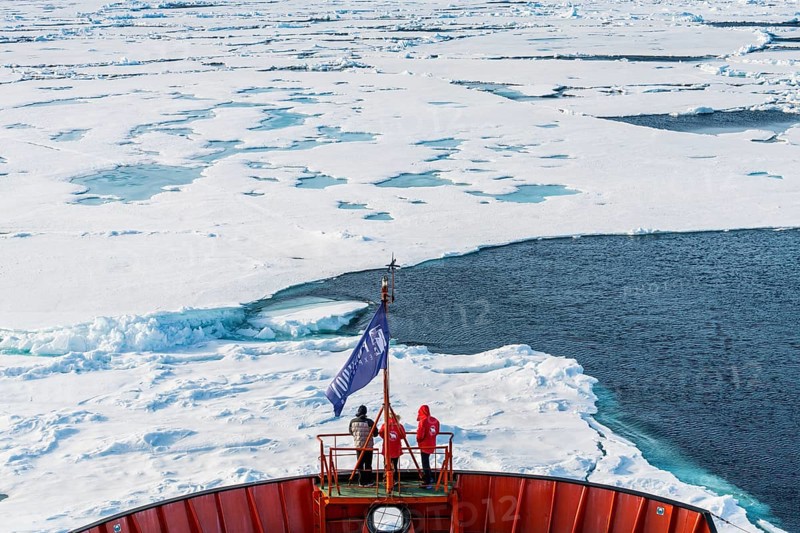 Tourists watching the ice breaking on board of an icebreaker