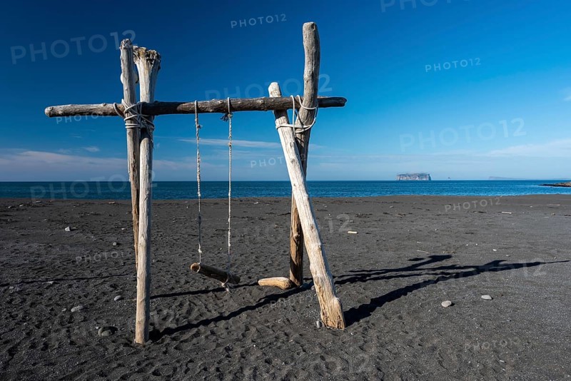 Swing made of driftwood