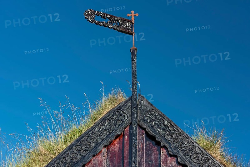 Panel and grass roof decorated with carvings