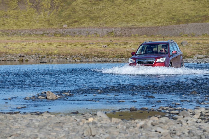 SUV driving through ford Geirlandsa river