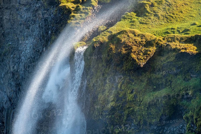 Waterfall falls over cliff and is blown away by wind