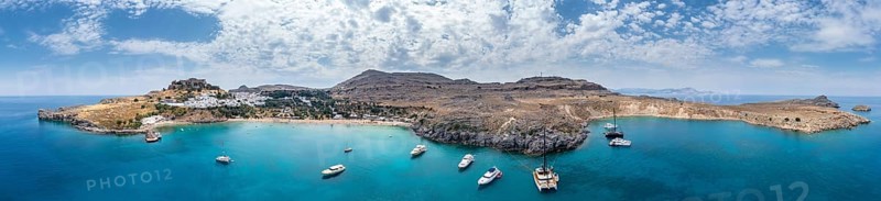 Sailboats anchoring in front of Lindos