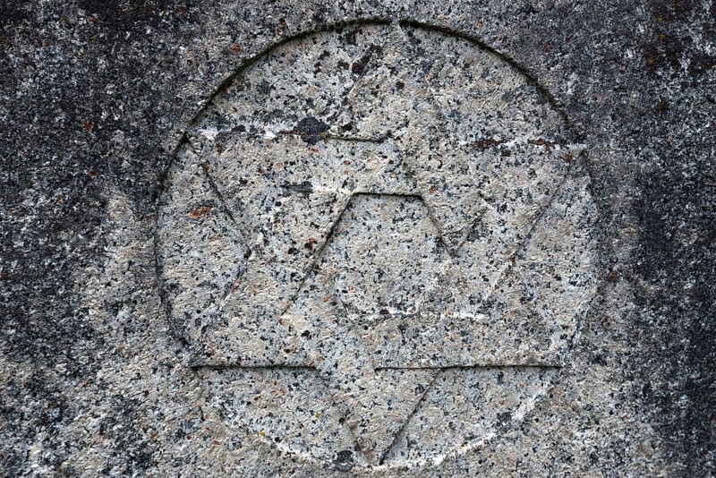 Weathered Star of David on a gravestone