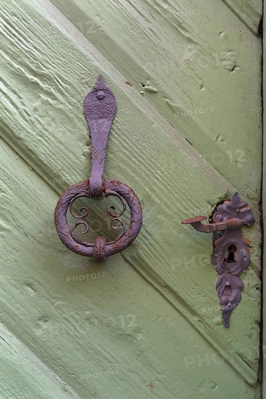 Old door knocker and door handle around 1520