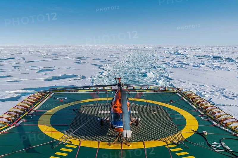 Helicopter on the Helipad of the Icebreaker '50 years of victory' on its way to the North Pole breaking through the ice