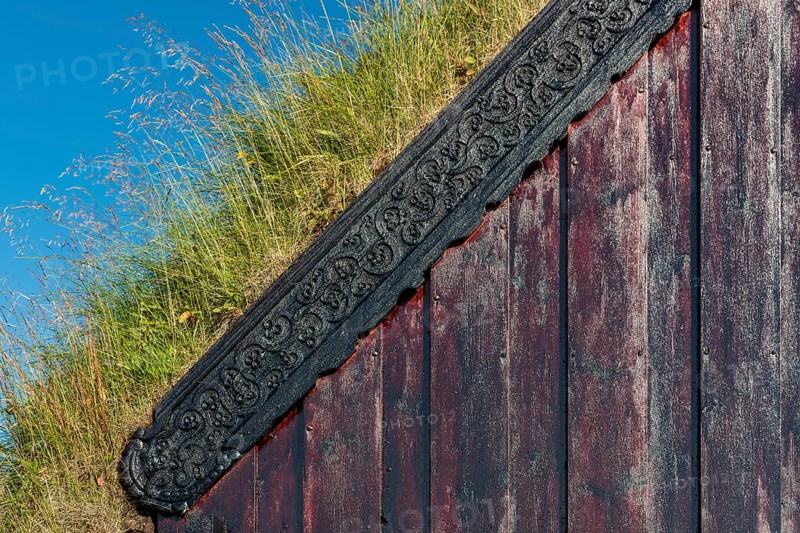 Panel and grass roof decorated with carvings