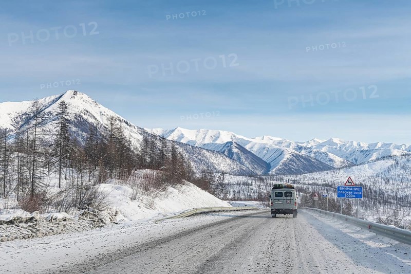 Minivan driving on the Road of Bones