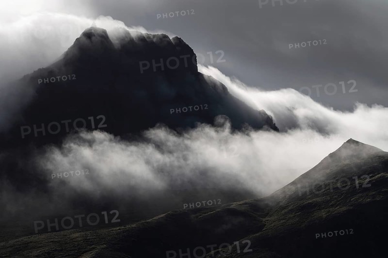 Cloudy craggy mountain