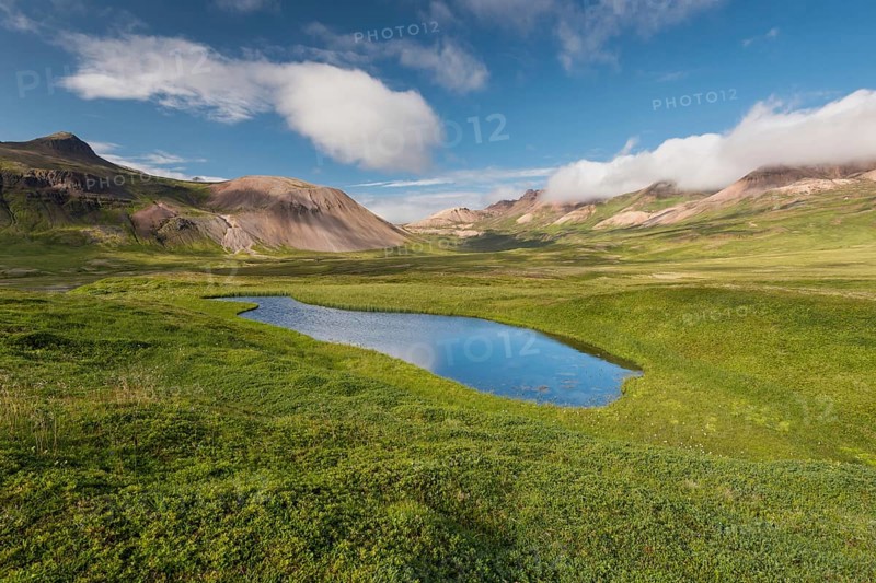 Lake and coloured rhyolite mountains