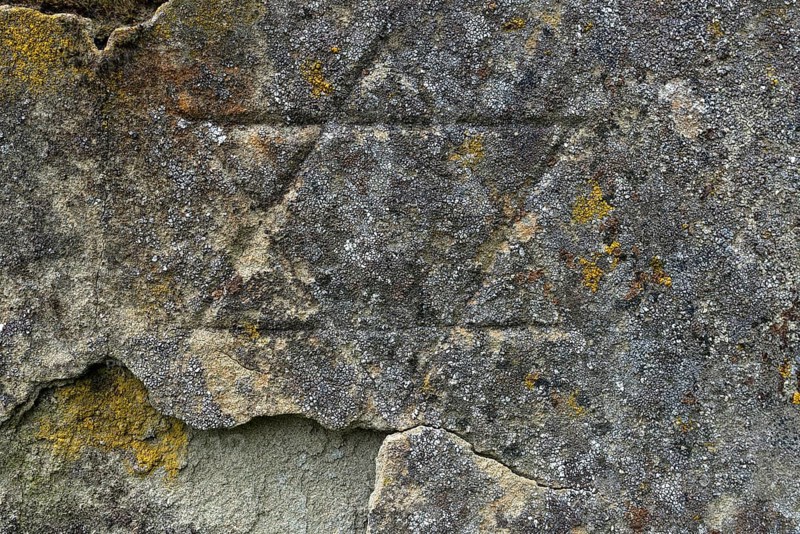 Weathered Star of David on a gravestone