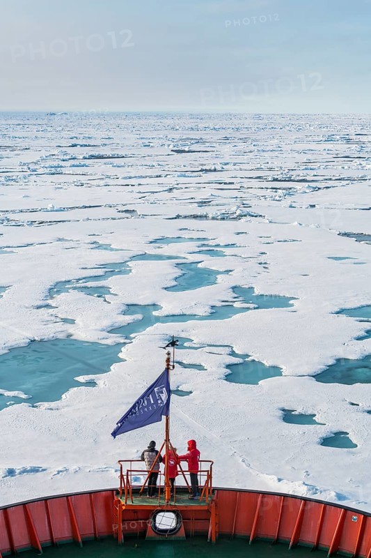 Tourists watching the ice breaking on board of an icebreaker