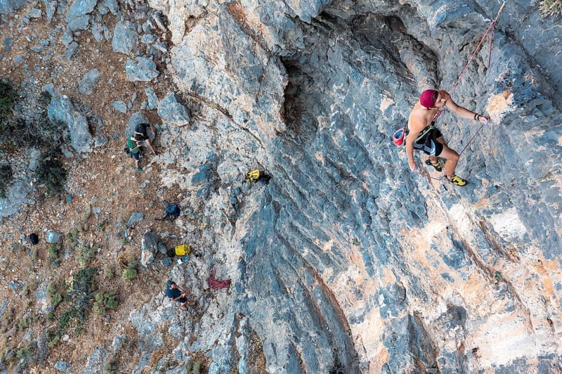Climber climbing on a rock face