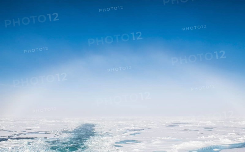 Fog bow or white rainbow in the ice around the North Pole