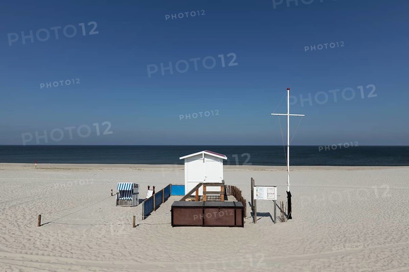 Deserted beach with lifeguard hut