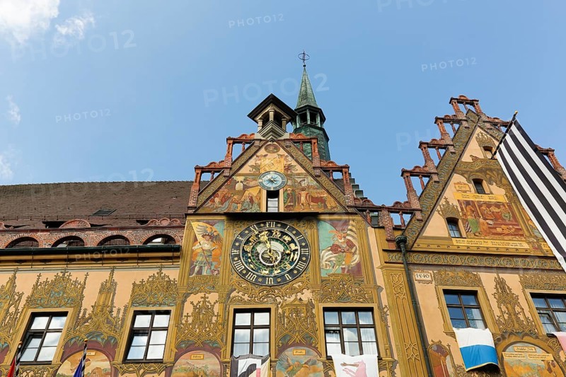Richly decorated astronomical clock with signs of the zodiac on the town hall
