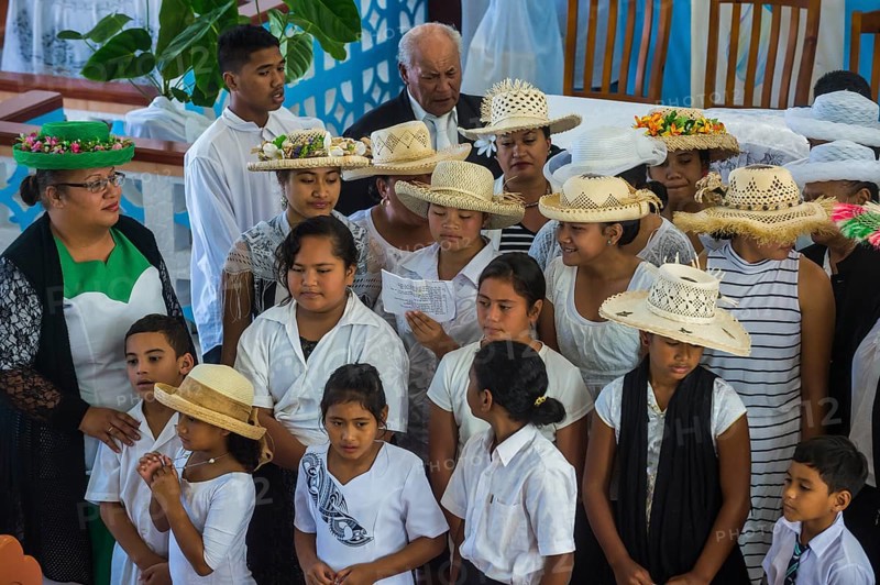 Women with traditional hats on a church service