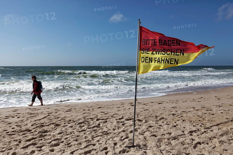Monitored beach with red-yellow signal flag