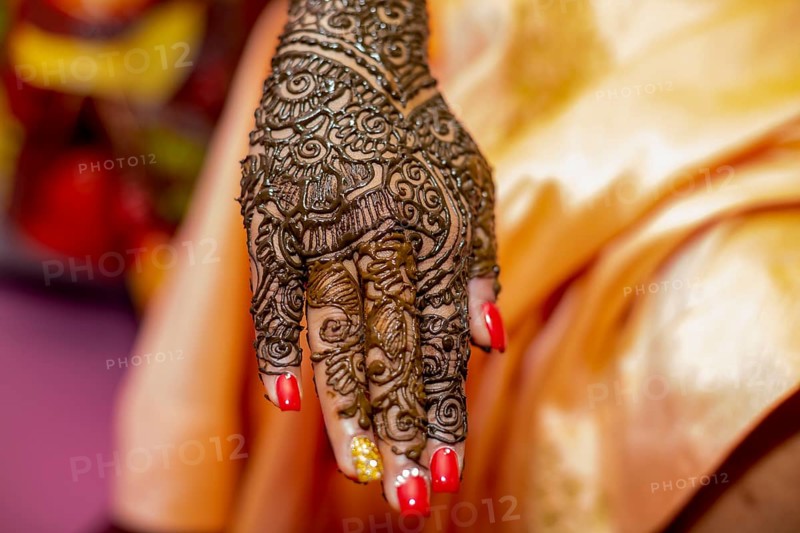 Hand of a Hindu bride painted with henna on the eve of her wedding in Beau-Bassin