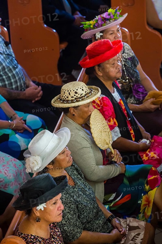 Women with traditional hats on a church service