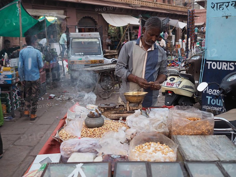 Vendor offers pulses at the market stall