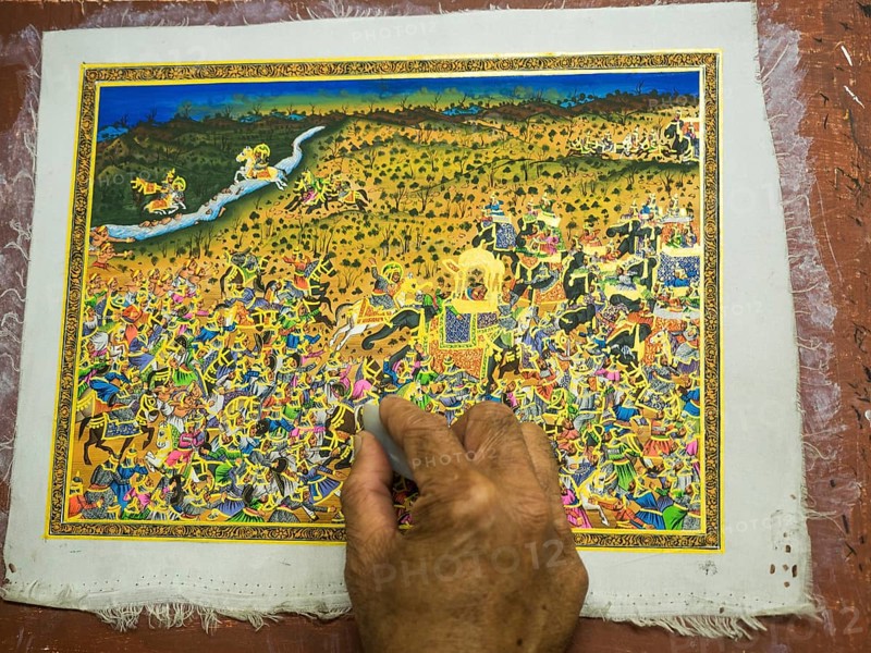 Artist creates traditional miniature painting