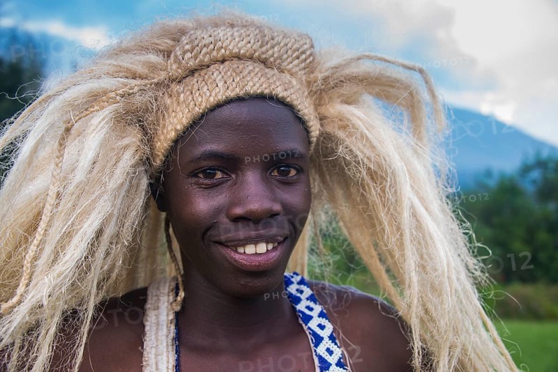 Young man with a wig on a ceremony of former poachers