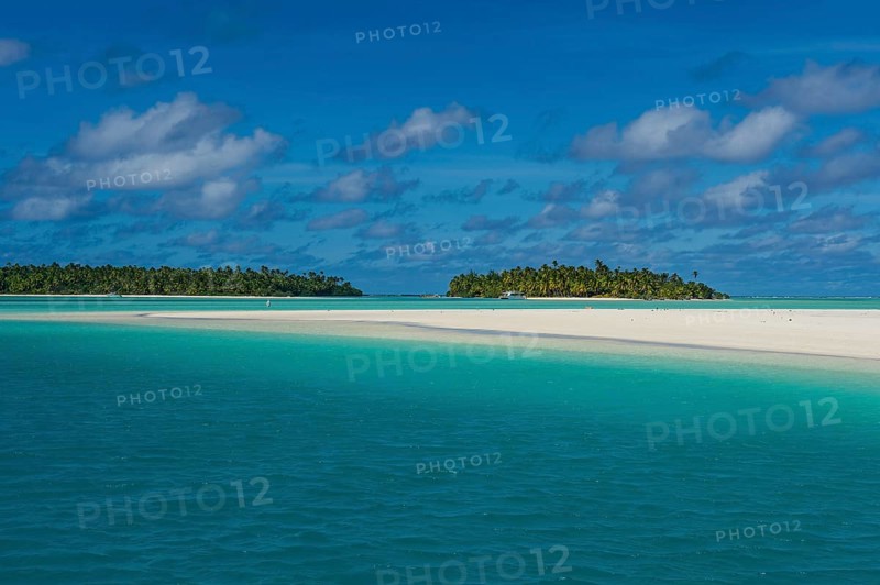 White sand beach and palm fringed beach in Aitutaki lagoon