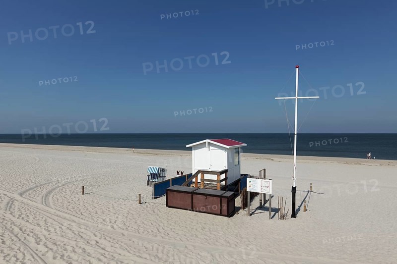 Deserted beach with lifeguard hut