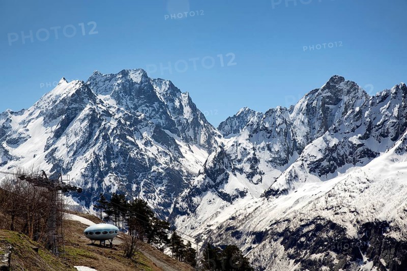 Snowcapped mountains against clear blue sky