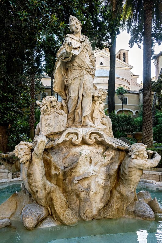 Fountain in the courtyard of Palazzo Venezia with allegorical fountain figure