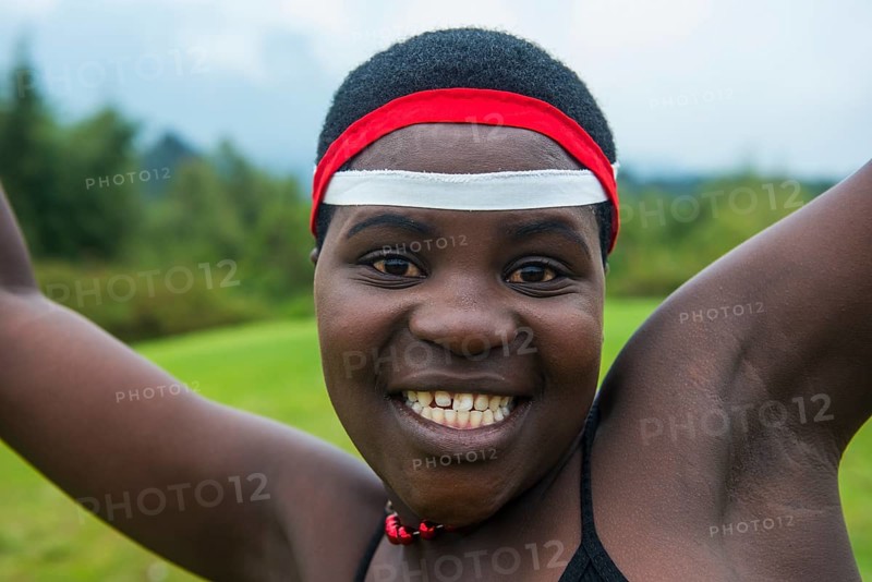 Woman starring at the camera at a ceremony of former poachers