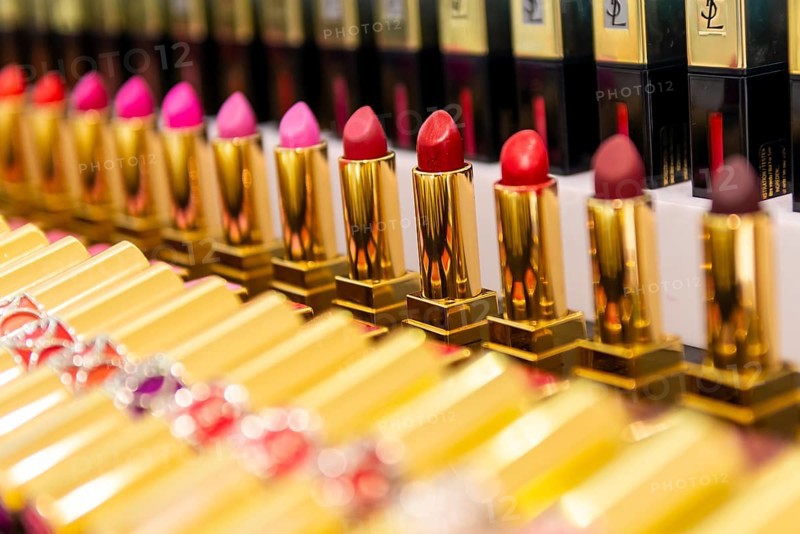 Lined up lipsticks in different shades of red