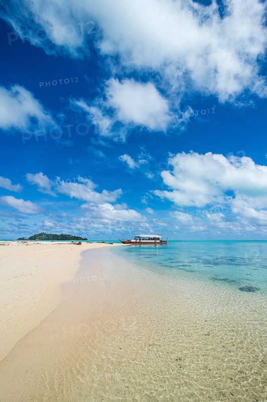 Traditional wood carved boat in the Aitutaki lagoon