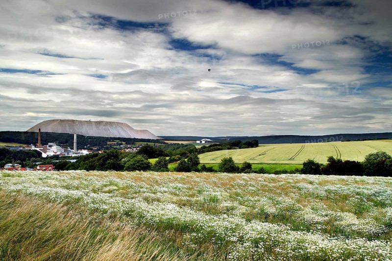 View over fields to village and overburden salt dump