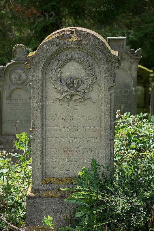Gravestone with wreath at the historic Jewish cemetery