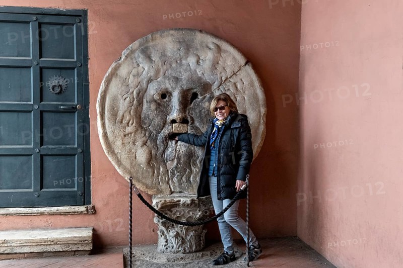 Western tourist puts hand in mouth of truth