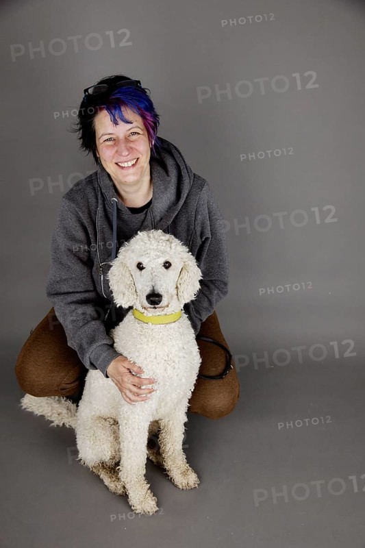 Woman with white king poodle