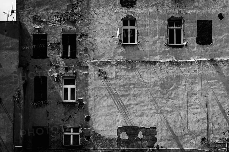 Facade of a decaying building in a small town