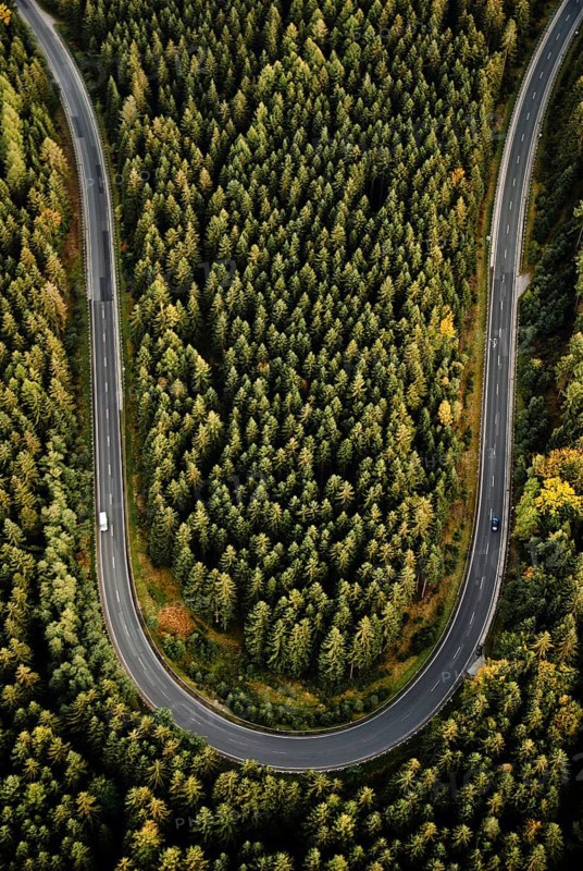 Curve of country road from above in the Thuringian Forest