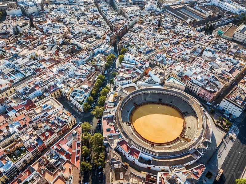 Bullring of the Real Maestranza de Caballeria surrounded by white architecture in Sevilla