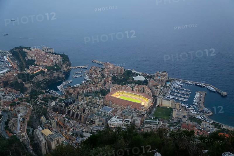 Illuminated sports stadium Stade Louis II in the Fontvieille district in front of a UEFA Champions League match of the football club AS Monaco
