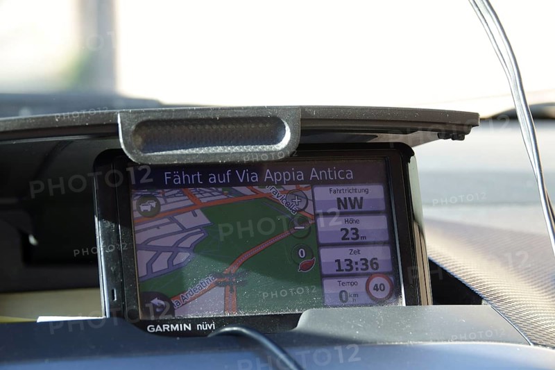 Garmin navigation device in a car driving on the Via Appia Antica