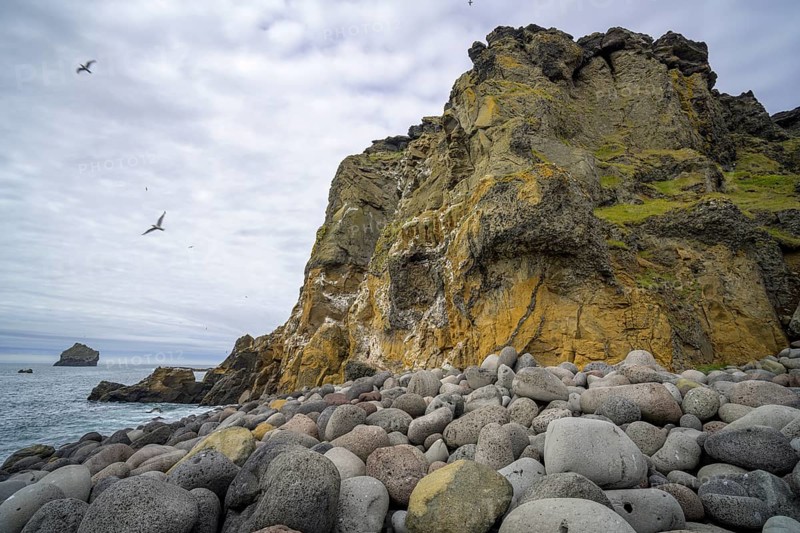 Cliff and large round stones