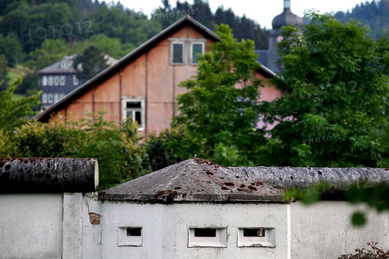 Border wall in front of residential house
