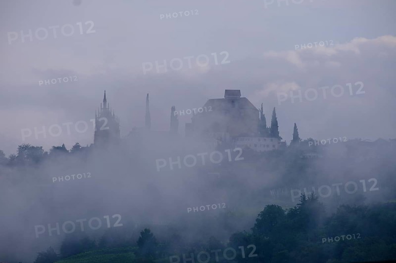 Clouds and fog around the Mausoleum and Parish Church of the Assumption of the Virgin Mary