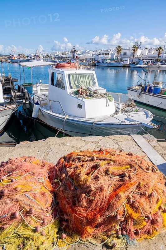 Harbour with fishing boat and nets