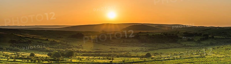 Sunset over fields in Haytor Rocks