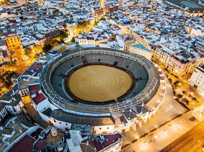 Bullring of the Real Maestranza de Caballeria surrounded by white architecture in Sevilla