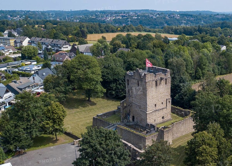 Fortified castle tower of ruin of partly reconstructed former moated castle Burg Altendorf from the Middle Ages